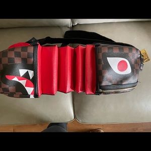 SPRAYGROUND SHARK BITE…SHARKS IN PARIS BACKPACK…BROWN